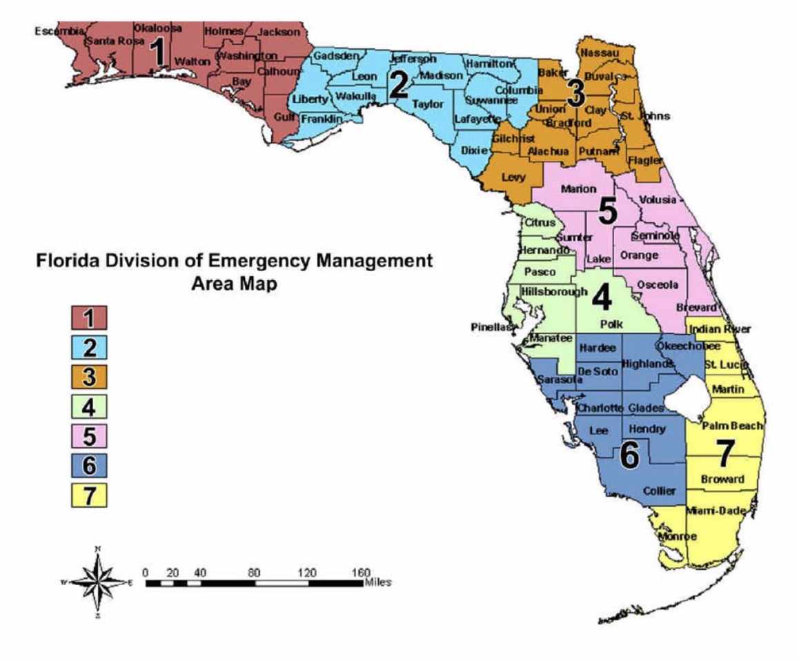 Emergency response team monitoring drone feed on multiple screens in a command center